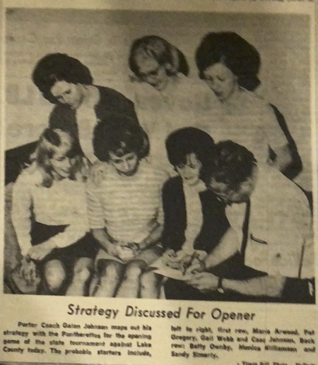B&W newspaper photo of Coach Galen Johnson mapping strategy with 1967 team members: Marie Arwood, Pat Gregory, Gail Webb, Betty Ownby, Monica Williams & Sandy Simerly.