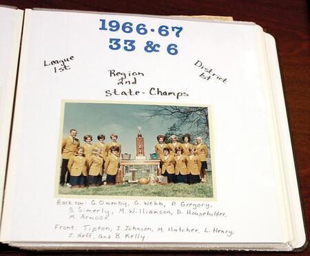 Color photograph of a scrapbook page. Photo show the 1967 state champion girls basketball team from Porter High School and coach Galen Johnson.